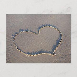 Heart shape drawn in the sand. postcard