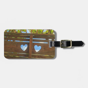 Heart shape in a fence, Belise Luggage Tag