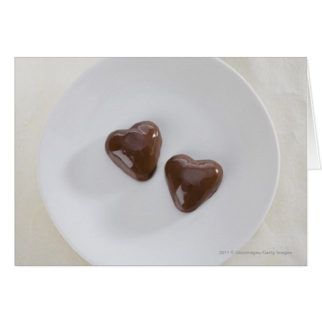 Heart shaped chocolate candies on a plate (Front Horizontal)