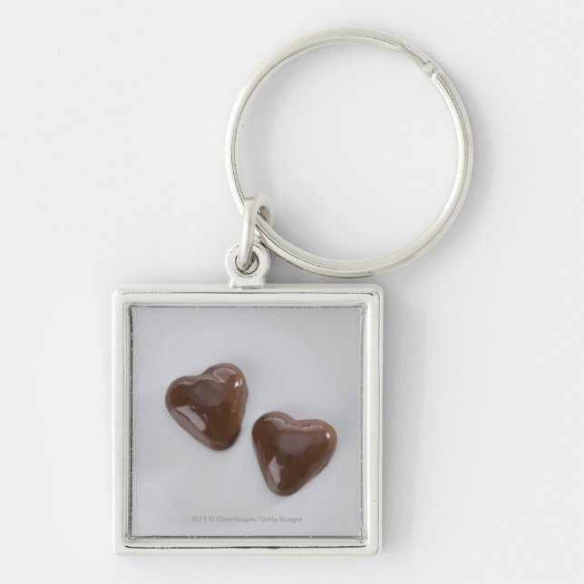 Heart shaped chocolate candies on a plate key ring (Front)