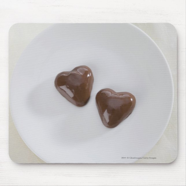 Heart shaped chocolate candies on a plate mouse pad (Front)