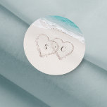 Hearts in the sand destination beach wedding classic round sticker<br><div class="desc">Features two hearts in the sand and the bride's and groom's initials with turquoise water and white sand beach background,   great for summer beach wedding,  or tropical destination wedding.</div>