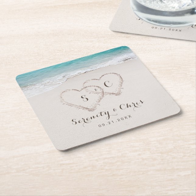 Hearts in the sand destination beach wedding square paper coaster (Angled)