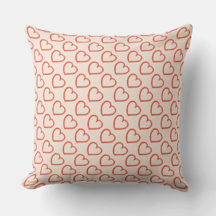 Hearts pattern red on pink cushion