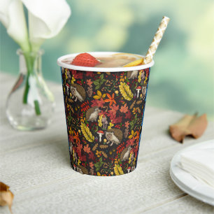 Hedgehogs and autumn forest flora on black paper cups