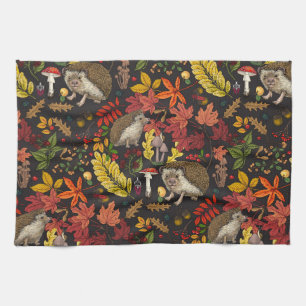 Hedgehogs and autumn forest flora on black tea towel