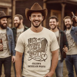 He's Tying the Knot Western Cowboy Bachelor Party T-Shirt<br><div class="desc">Celebrate with the Groom-to-be's bachelor party with these cute t-shirts. The rustic woodcut design features vintage lettering reading "He's Tying the Knot!" with a western cowboy boot and lasso rope forming a heart shape. There is space for his name and the date of the event.</div>