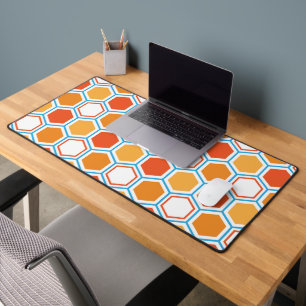 Hexagon in orange, blue and white desk mat