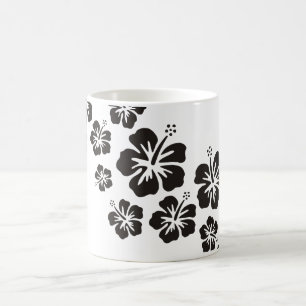 hibiscus blooms in black coffee mug