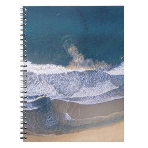 HIGH-ANGLE PHOTOGRAPHY OF BEACH SHORE NOTEBOOK