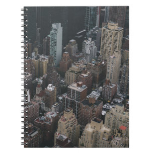 HIGH-ANGLE PHOTOGRAPHY OF CITY BUILDING S NOTEBOOK