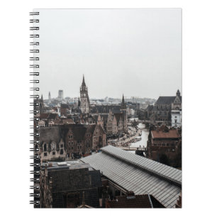 HIGH-ANGLE PHOTOGRAPHY OF CONCRETE HOUSES NOTEBOOK