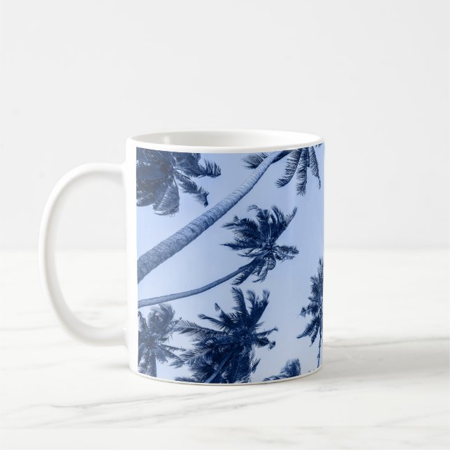High palm trees, clear blue sky. coffee mug (Left)