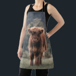 Highland cow calf autumn grass field apron<br><div class="desc">Highland cow calf autumn grass field photograph. Stunning young calf of highland Scottish cattle on an autumn grassy field with muted colours. Beautiful dark hairy orange coat contrasting with light yellow green grass and trees in bokeh in background.</div>