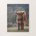 Highland cow calf autumn grass field jigsaw puzzle<br><div class="desc">Highland cow calf autumn grass field photograph. Stunning young calf of highland Scottish cattle on an autumn grassy field with muted colours. Beautiful dark hairy orange coat contrasting with light yellow green grass and trees in bokeh in background.</div>