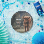 Highland cow calf monogram first birthday party paper plate<br><div class="desc">Highland cow calf monogram first birthday party. Stunning young calf of highland scottish cattle on an autumn grassy field with muted colours. Beautiful dark hairy orange coat contrasting with light yellow green grass and trees in bokeh in background. Custom personalizable monogram with your name and initial on the left. Everything...</div>