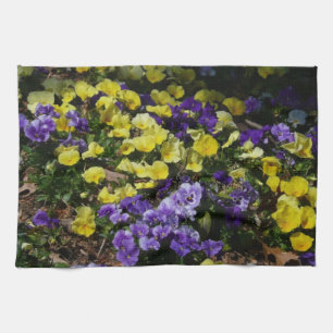 Hillside of Purple and Yellow Pansies Tea Towel