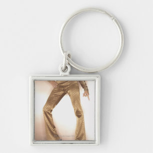 Hip woman in gold disco dancing key ring