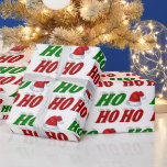 Ho Ho Ho Santa Hat Christmas red green typography Wrapping Paper<br><div class="desc">Wrapping paper with ho ho ho in 3D green and red text and a Santa Claus hat. Available in several styles and sizes.</div>