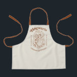 HOGWARTS™ School of Witchcraft and Wizardry Crest Apron<br><div class="desc">Honor the legacy of the wizarding world with this timeless Hogwarts™ School of Witchcraft & Wizardry crest design. Featuring the iconic four-house shield — lion, serpent, badger, and eagle — this elegant artwork represents the unity and tradition of Gryffindor™, Slytherin™, Hufflepuff™, and Ravenclaw™. Rendered in a refined, vintage-inspired line style,...</div>