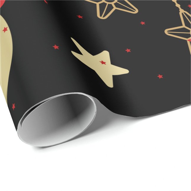 Holiday Ornaments Wrapping Paper (A roll of wrapping paper with a black background and a pattern of gold stars and red stars. )