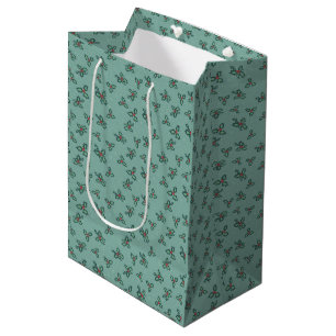 Holly and snowflakes on turquoise medium gift bag