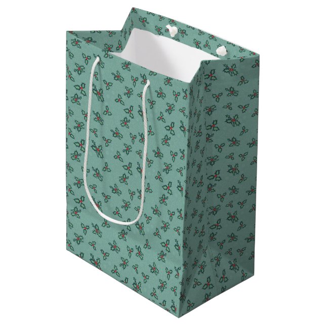 Holly and snowflakes on turquoise medium gift bag (Front Angled)
