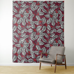 Holly berry, grey leaves on dark red tapestry