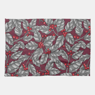 Holly berry, grey leaves on dark red tea towel