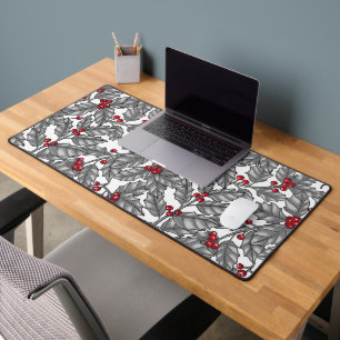 Holly berry, grey leaves on white desk mat