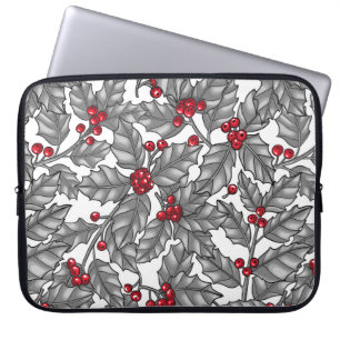 Holly berry, grey leaves on white laptop sleeve