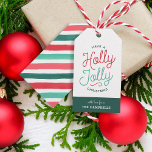 Holly Jolly Stripes Christmas Gift Tags<br><div class="desc">Custom printed holiday gift tags personalised with your family name or other text. This fun two-sided design features colourful modern typography with a bright Christmas striped background on the reverse side. The text reads "Have a Holly Jolly Christmas". Use the design tools to edit the text fonts and colours, add...</div>