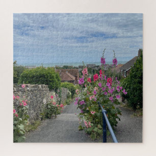 Hollyhocks alongside St Leonards Church wall Hythe Jigsaw Puzzle