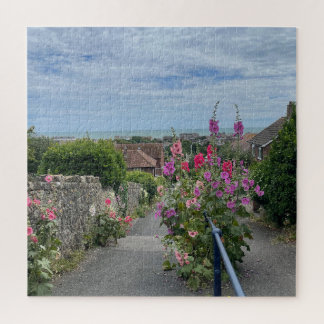 Hollyhocks alongside St Leonards Church wall Hythe Jigsaw Puzzle