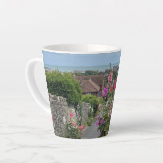 Hollyhocks alongside St Leonards Church wall Hythe Latte Mug