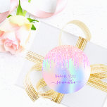 Holograpic unicorn glitter drip thank you birthday classic round sticker<br><div class="desc">A trendy holographic background with unicorn colors and rainbow colors in pink, purple, rose gold, mint green. Decorated with faux glitter drips in rose gold, pink and purple. The text: Thank You. Personalize and add your name, written with a modern hand lettered style script with swashes. Purple letters. o keep...</div>