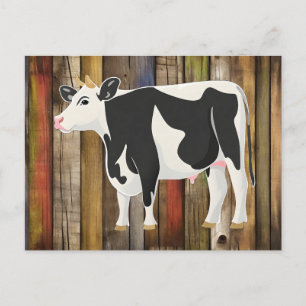 Holstein cow with old board background postcard