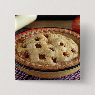 Home baked apple pie on cooling rack with apple 15 cm square badge