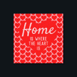 Home is Where The Heart Is Message Canvas Print<br><div class="desc">Home sweet home. An upbeat message that says "Home is Where The Heart Is". Red and Pink color theme with a large heart as the main motif. More smaller hearts form a patterned background.</div>