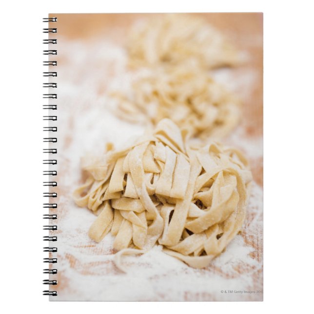 Homemade ribbon pasta, close up notebook (Front)