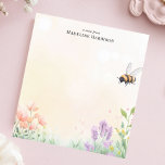 Honey Bee Floral Garden Personalised Name Notepad<br><div class="desc">Bring the beauty of a blooming garden to your desk with this personalised notepad. The design features a charming honey bee buzzing above a delicate array of wildflowers and grasses. The soft, pastel background adds to the natural, peaceful feel. Customise this notepad with your own text for a truly personal...</div>