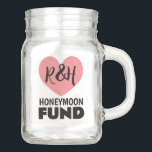 Honeymoon fund mason jar for newlyweds<br><div class="desc">Honeymoon fund mason jar for newlyweds. Collect money and funds in this jar glass jar. Handy finance pot for saving coins and paper bills. Also great for saving money for expensive trips, vacations, cars, gadgets and more. Personalise with your own name initials of bride and groom. Pink heart logo with...</div>