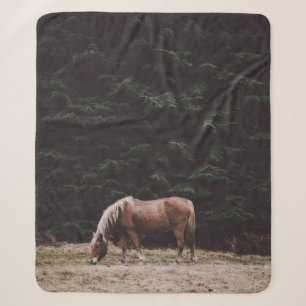 HORSE GRAZING IN THE SHADE OF CONIFERS SHERPA BLANKET