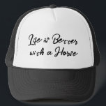 Horse lover white black trucker hat<br><div class="desc">Say it loud, wear it proud! This comfy-cool trucker hat features the phrase “Life is better with a horse” perfect for equestrians, ranch lovers, or anyone who knows the joy of hay-scented hugs. Want your own spin? Customise it with any short phrase that speaks to your lifestyle. Great for sunny...</div>