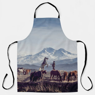 HORSES IN BROWN OPEN FIELD VIEWING MOUNTAIN AT DAY APRON
