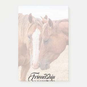 Horses nuzzling in a pasture post-it notes