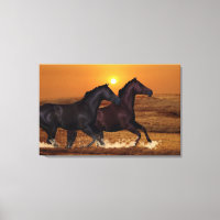 Horses running at ocean sunset