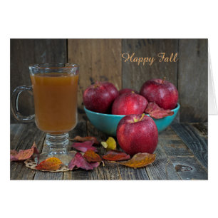 hot apple cider and red apples