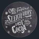Hot Cocoa Bar Chalkboard Classic Round Sticker<br><div class="desc">This chalkboard hot cocoa bar sticker features chalk hand lettering that says "Old Fashioned Sleigh Rides and Hot Cocoa" on a faux chalkboard background. The lettering features decorative swashes and ornamental swirls.</div>