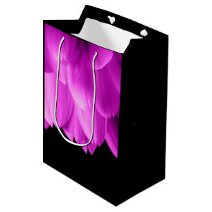 Hot pink flower petals on black medium gift bag